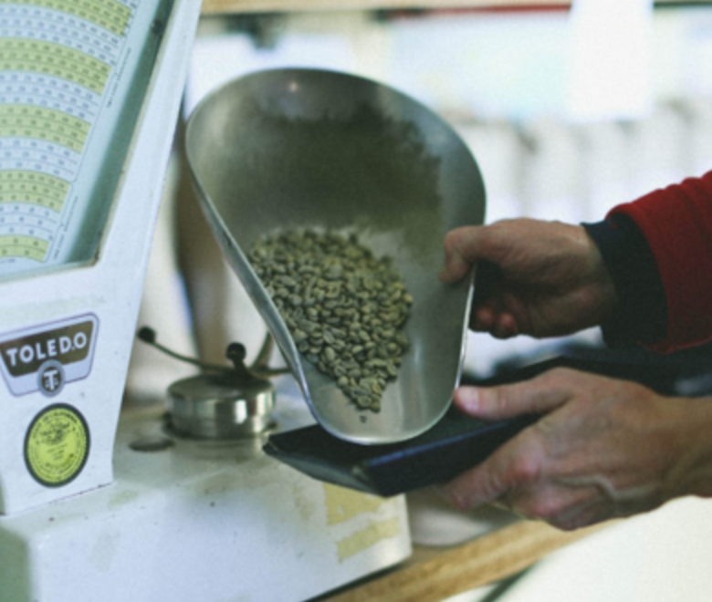 Webinars Weighing green coffee on a scale