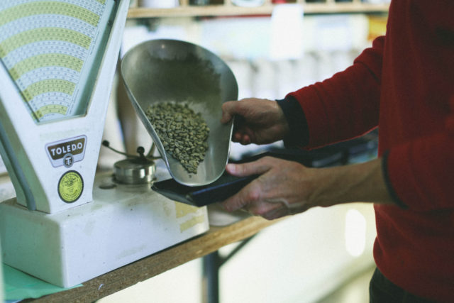 weighing green coffee 