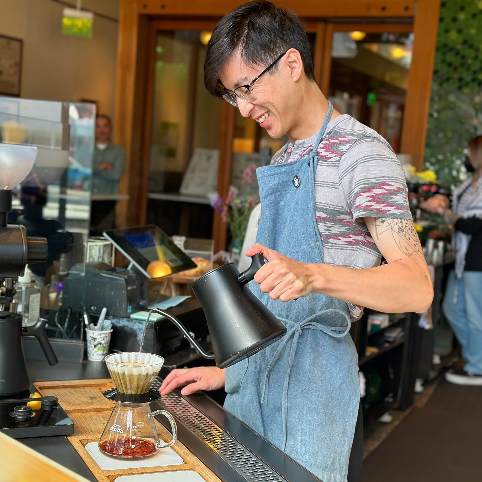 Tim Tran brewing coffee